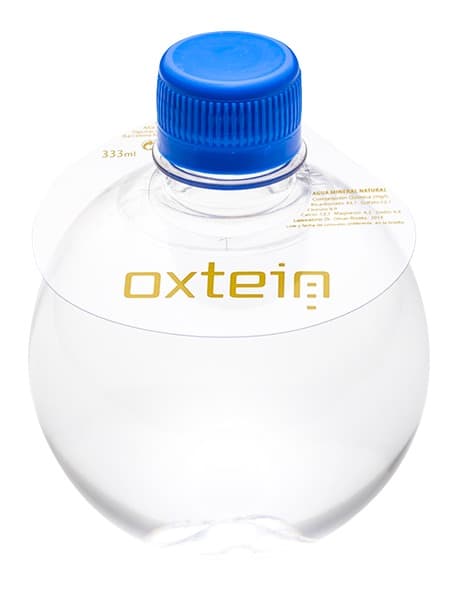 333 Botella redonda. Collarín PVC 1 color. Tapón azul